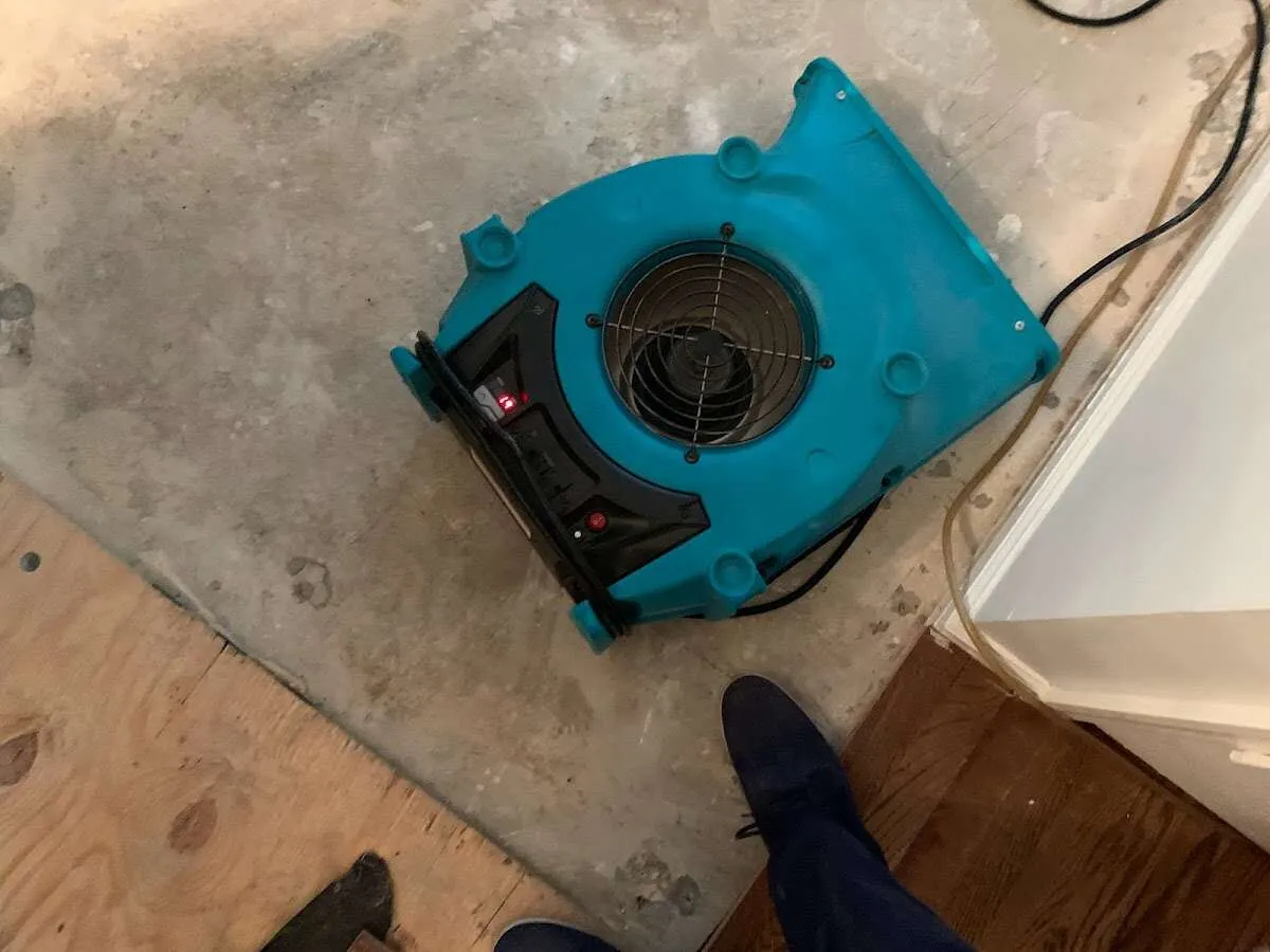 Air mover drying subfloor during Commercial Water Damage Restoration in Tanque Verde